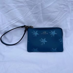 Blue Coach wristlet, 6 inches x 4 inches. In great condition.